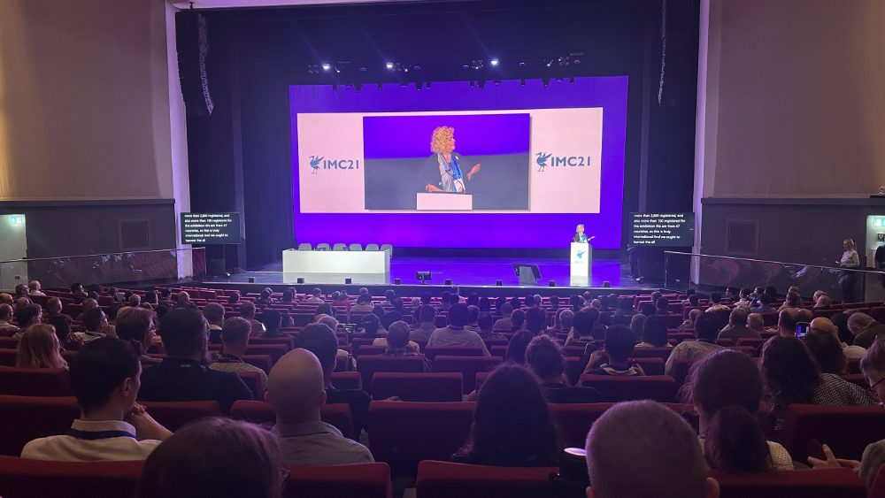 A wide view of the packed IMC21 plenary hall during the opening session